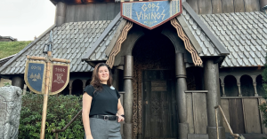Rosa posing in front of God of the Vikings in Norway pavilion at EPCOT