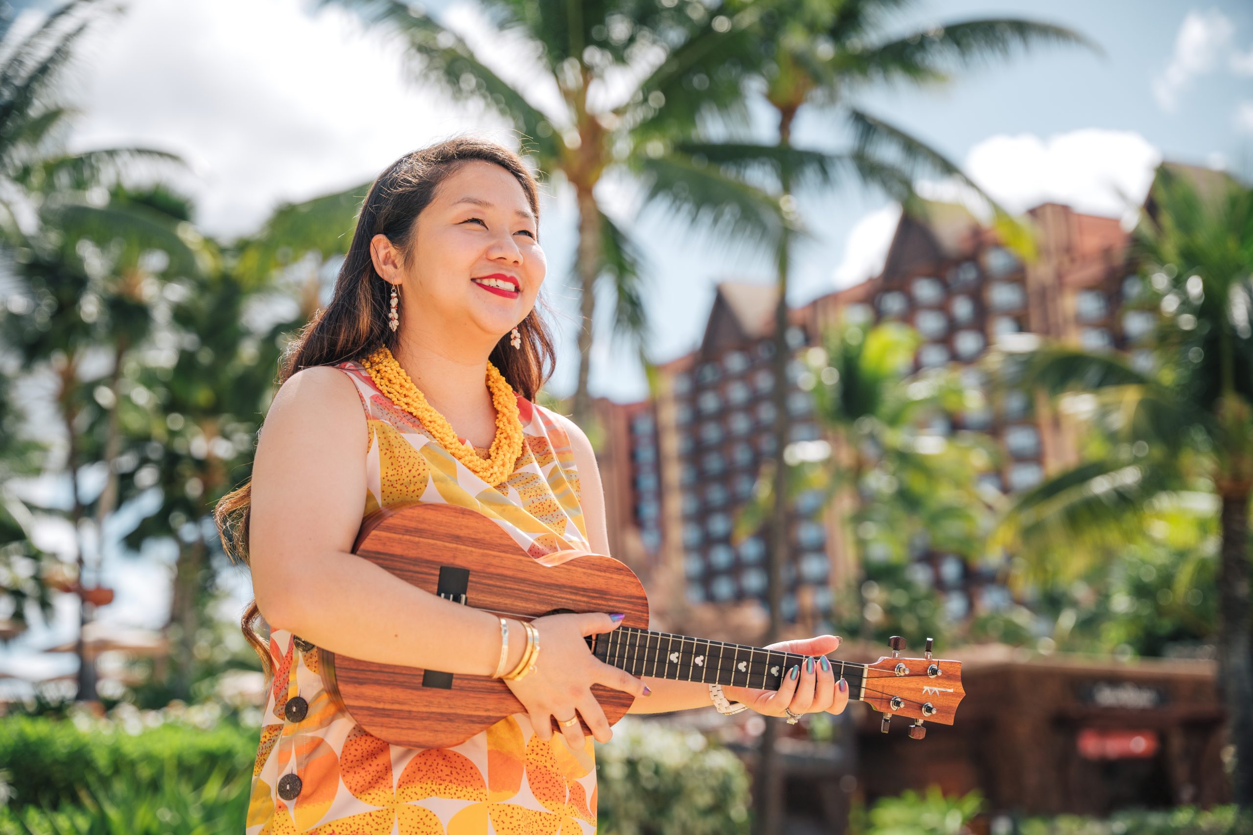Image of Dylan with ukulele in front of Aulani