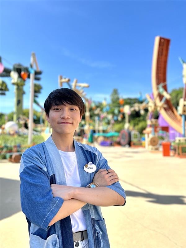 Boris posing at Hong Kong Disneyland with his nametag.