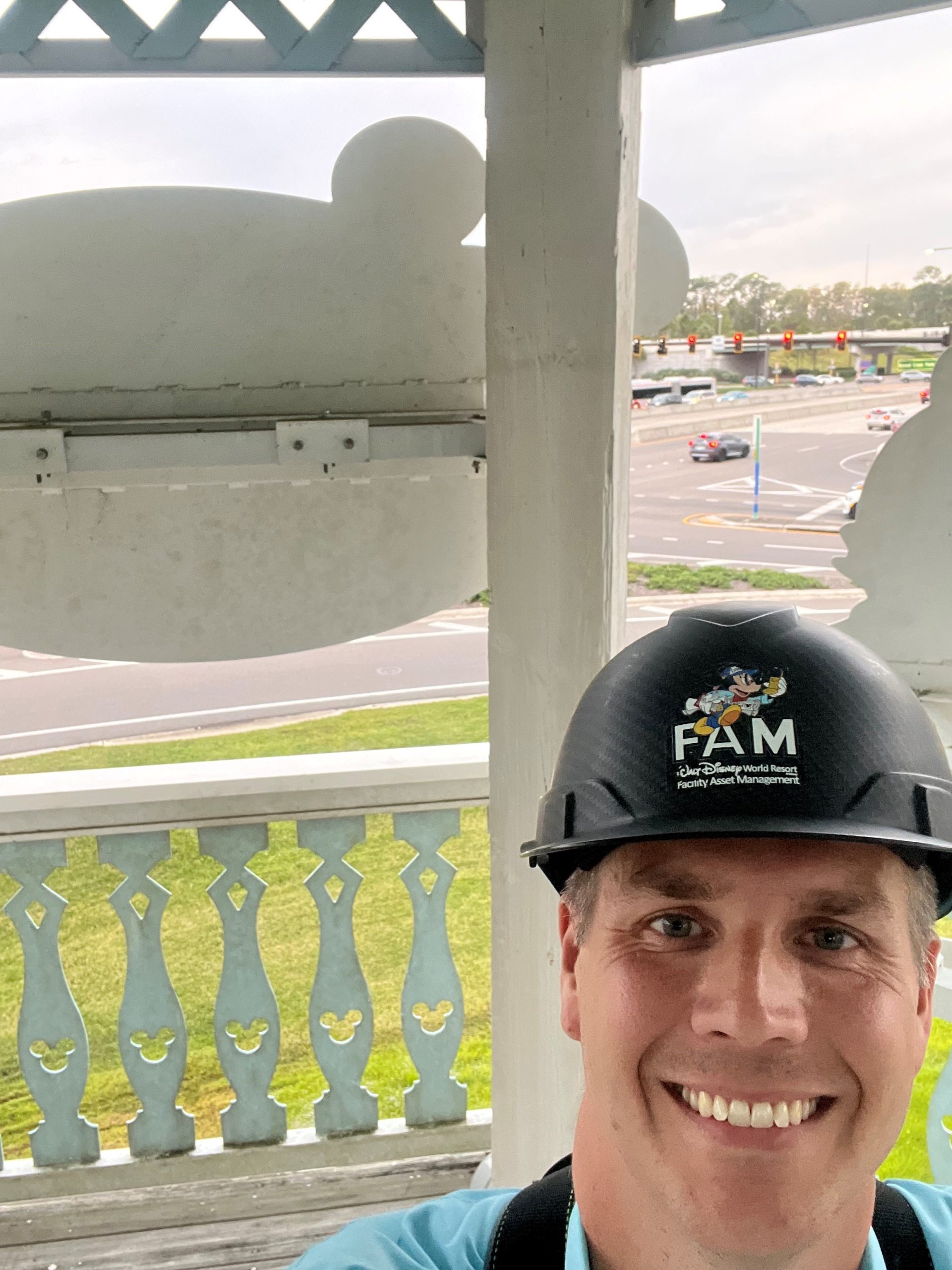 Cycle smiling at camera and wearing a hard hat
