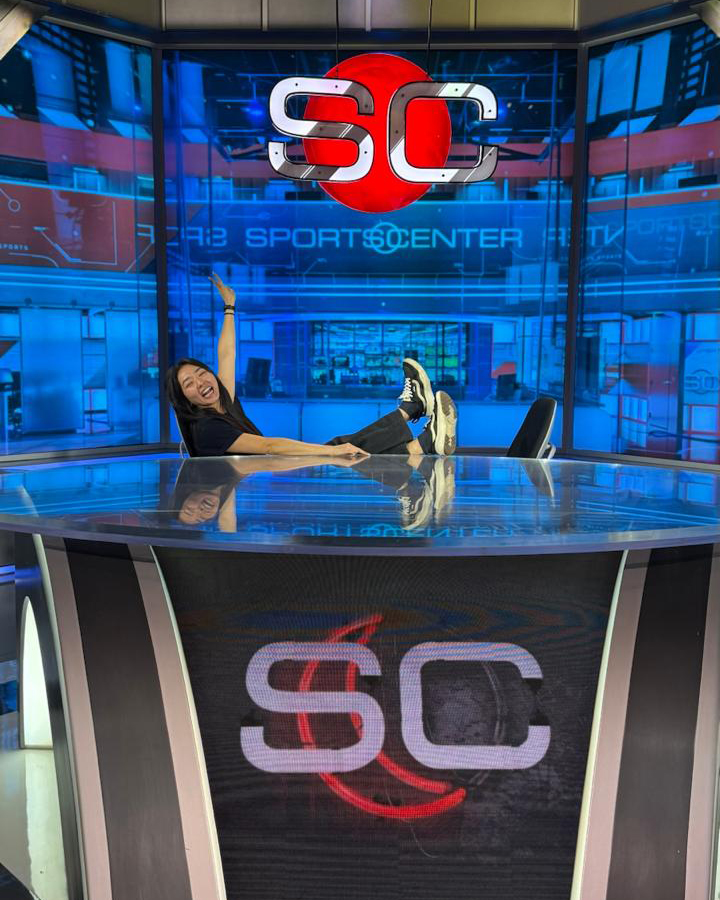 Early‑career Disney employee pictured at the ESPN SportsCenter studio, reflecting global career opportunities and hands‑on experience gained through Disney internships.