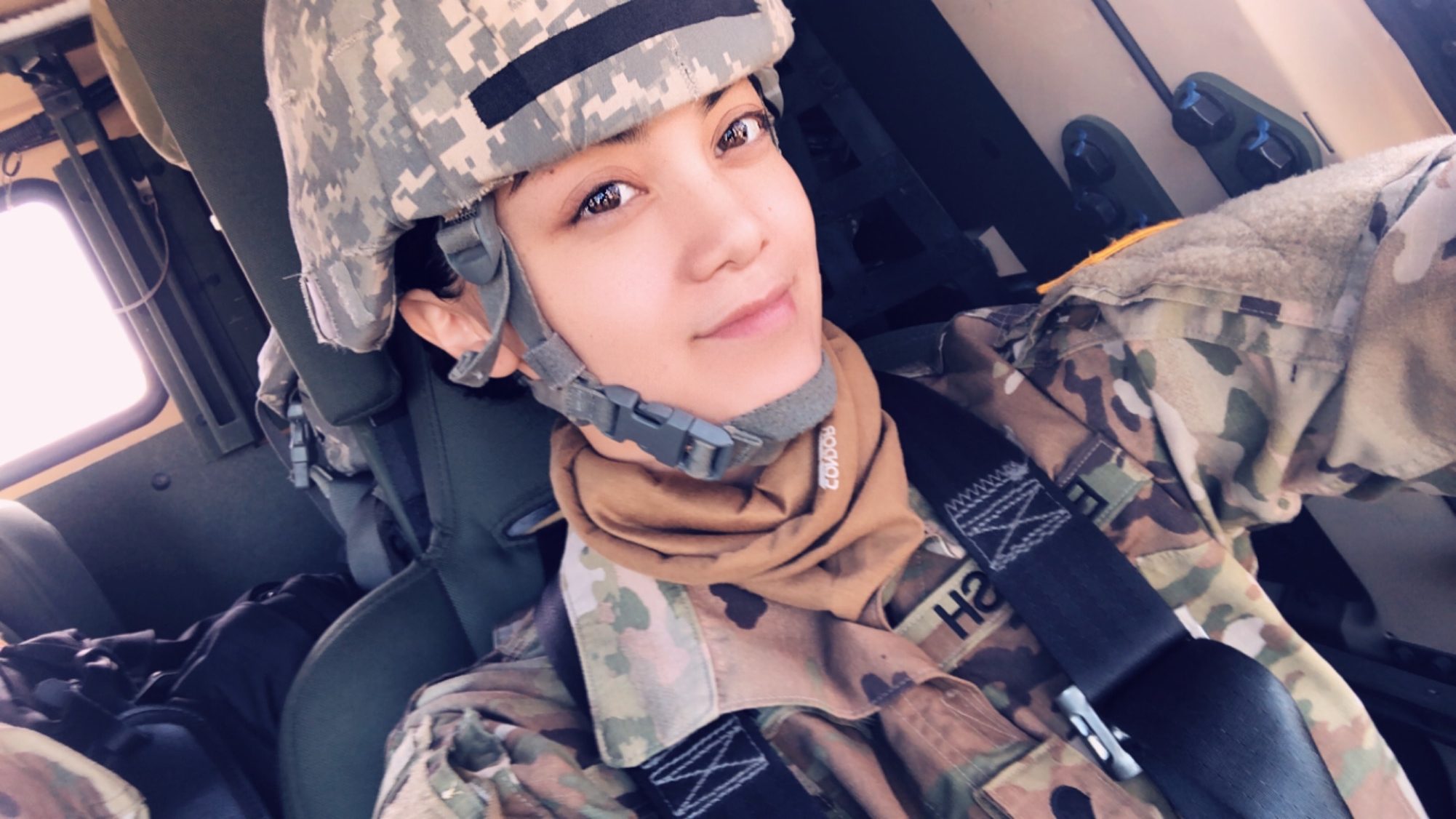 Carissa in military uniform smiling at camera.