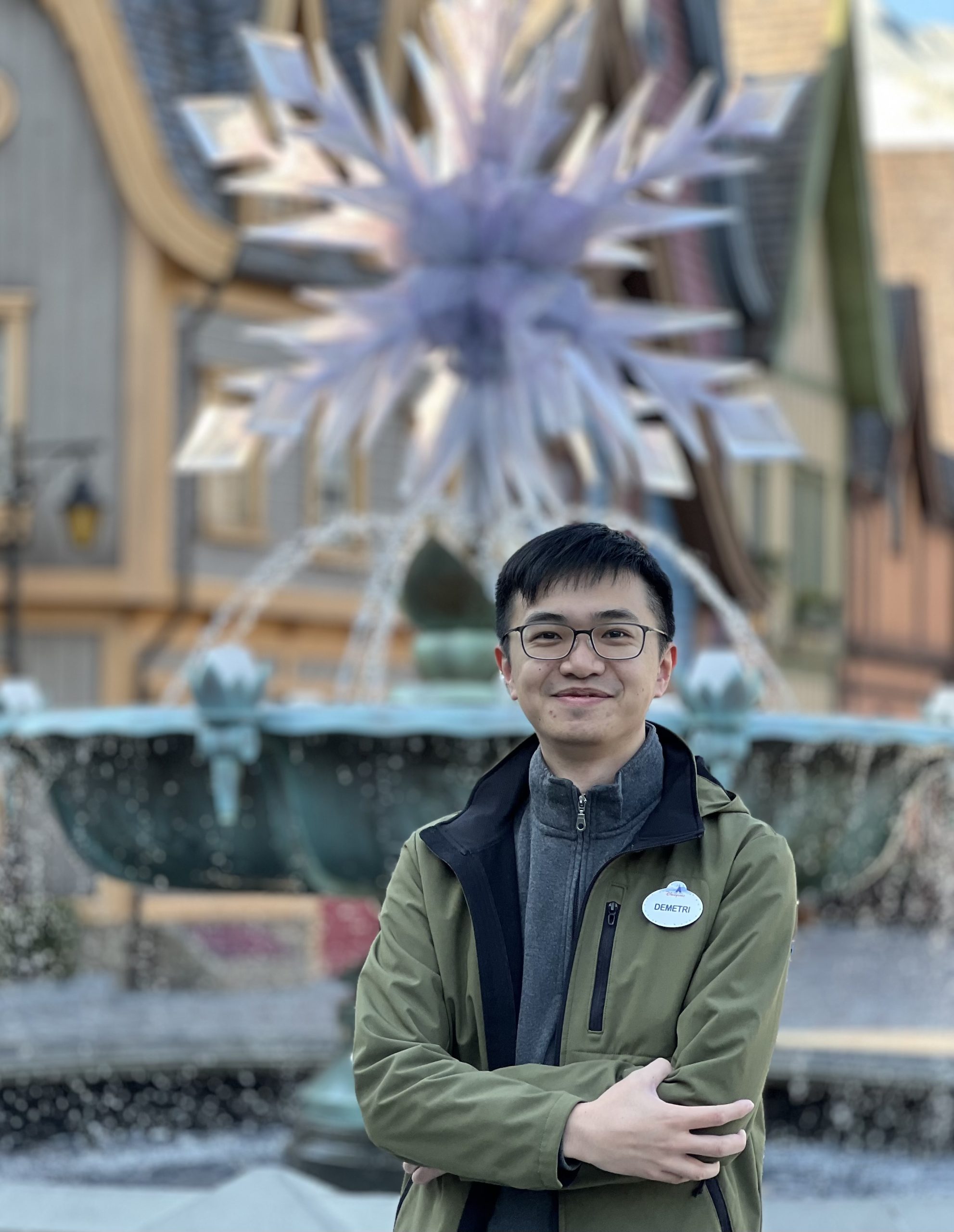 Image of employee in front of fountain at Hong Kong Disneyland