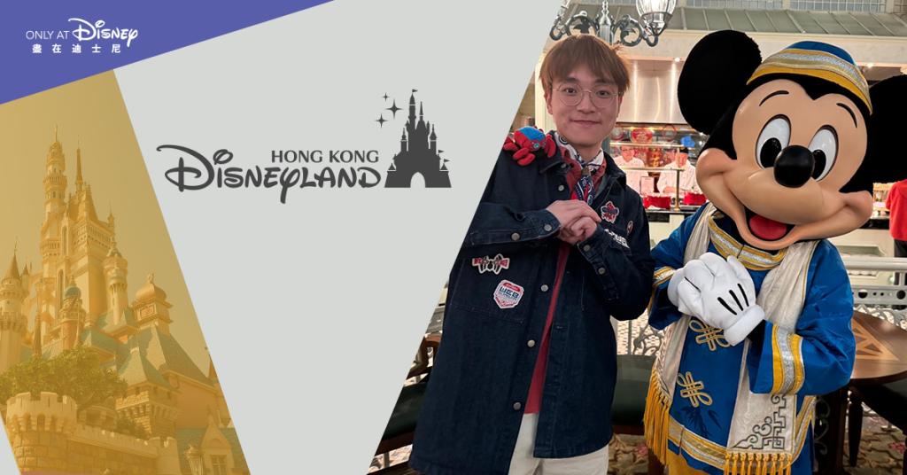 Boris posing with Mickey Mouse at Hong Kon Disneyland.