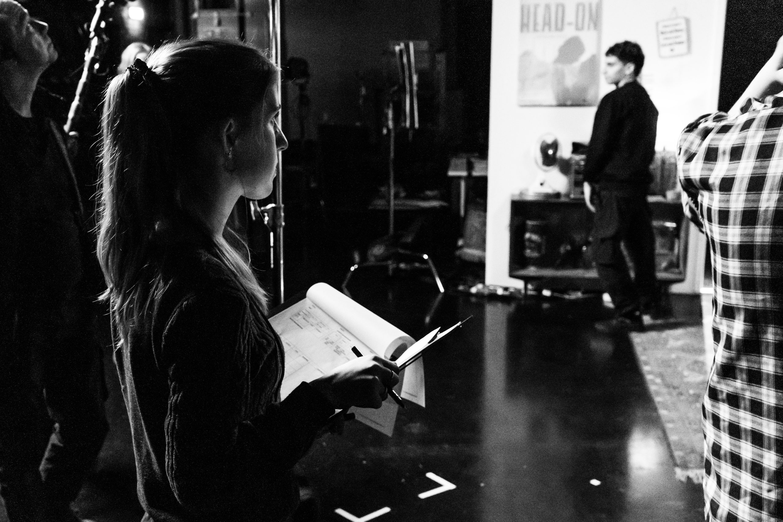 Anna script supervising on set.