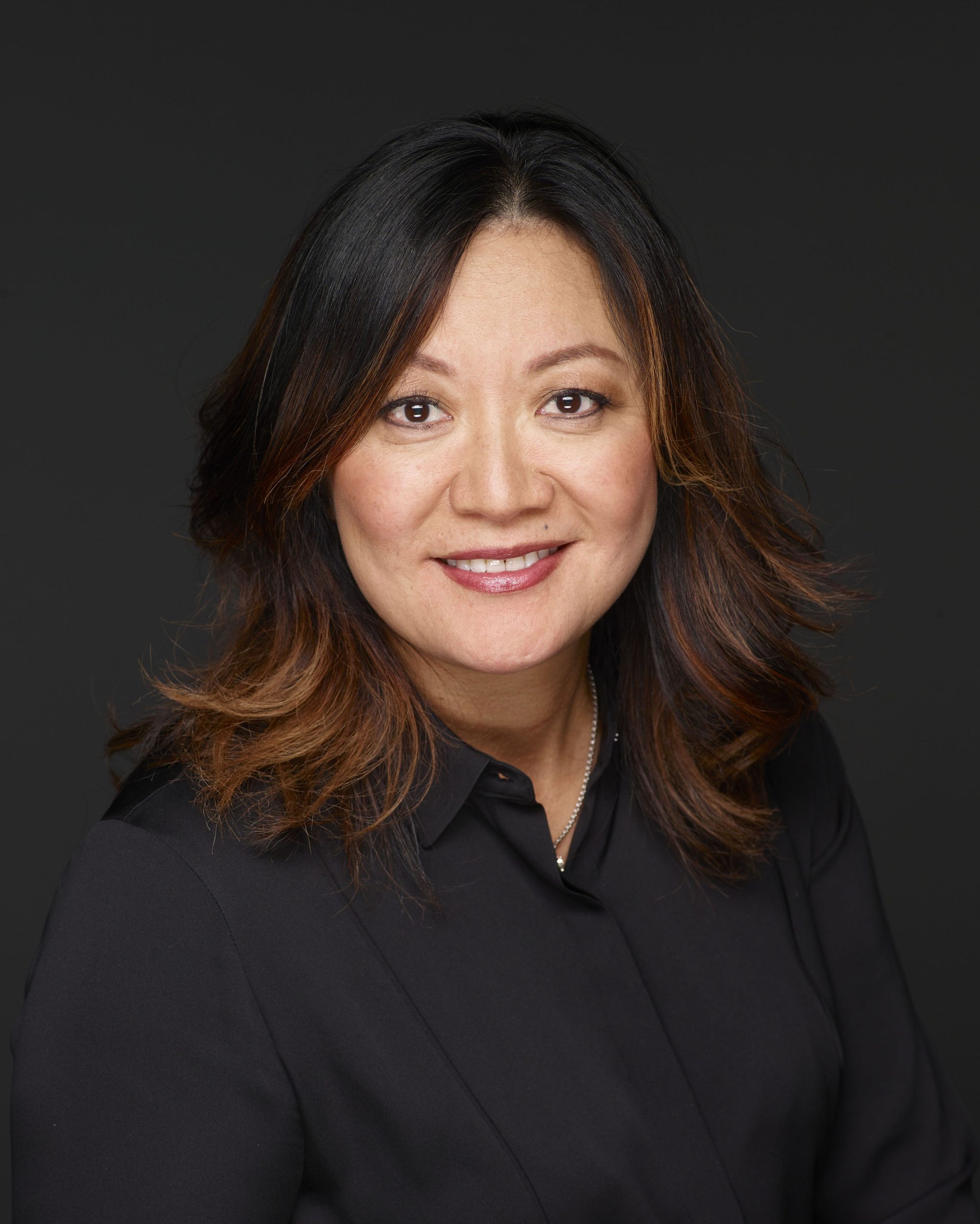 A professional portrait of a Life at Disney podcast guest, representing purpose‑driven storytelling and leadership within National Geographic and Disney.