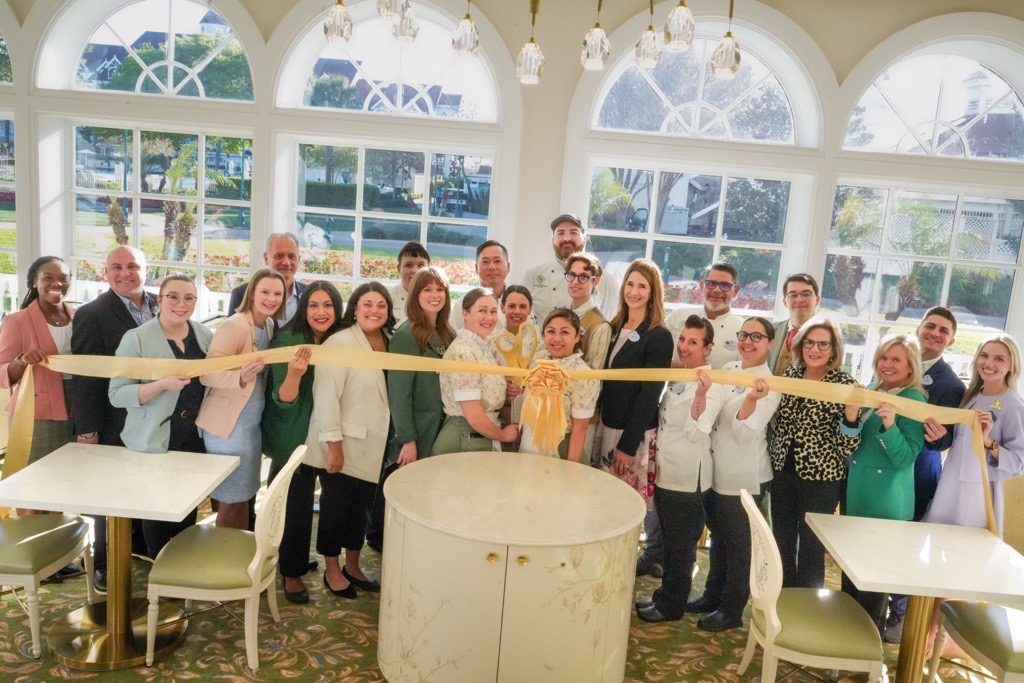 Grand Floridian Culinary team posing at gran opening of new tea experience at the Garden View Lounge.