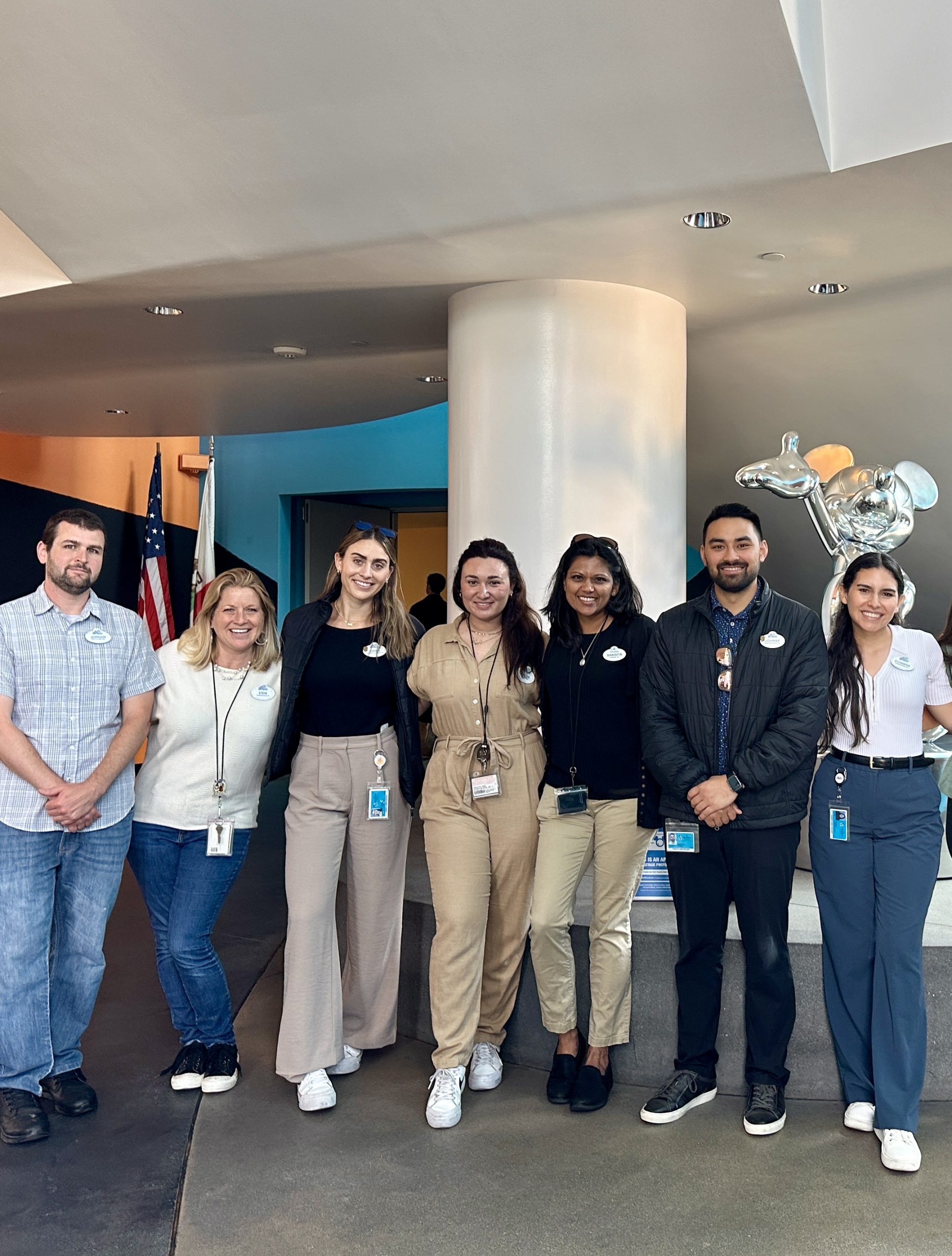 Sangita with coworkers in office.