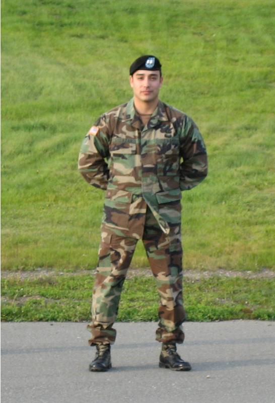 Will stands at attention in uniform.