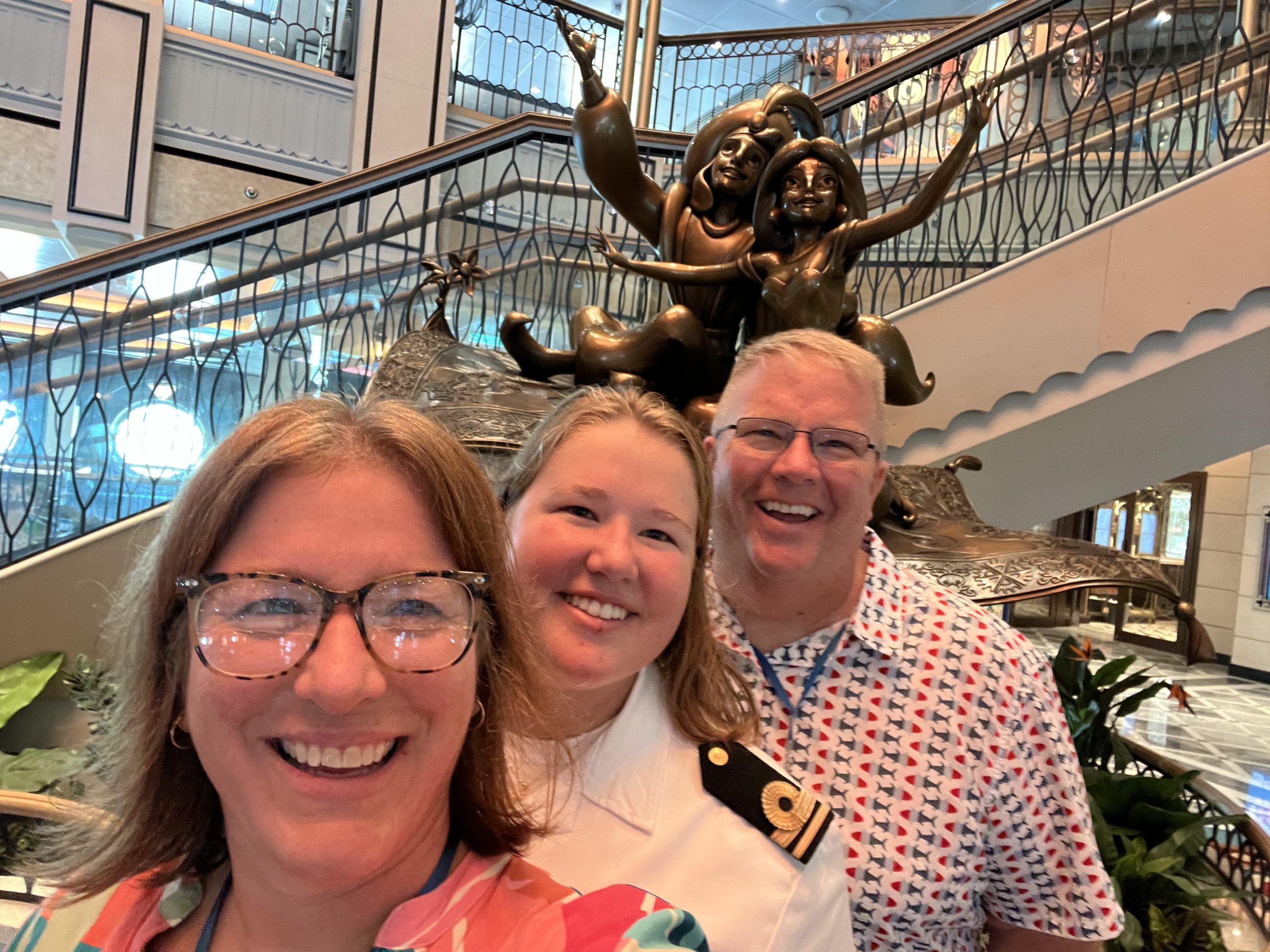Alli with her parents, who visited her aboard the Disney Treasure.