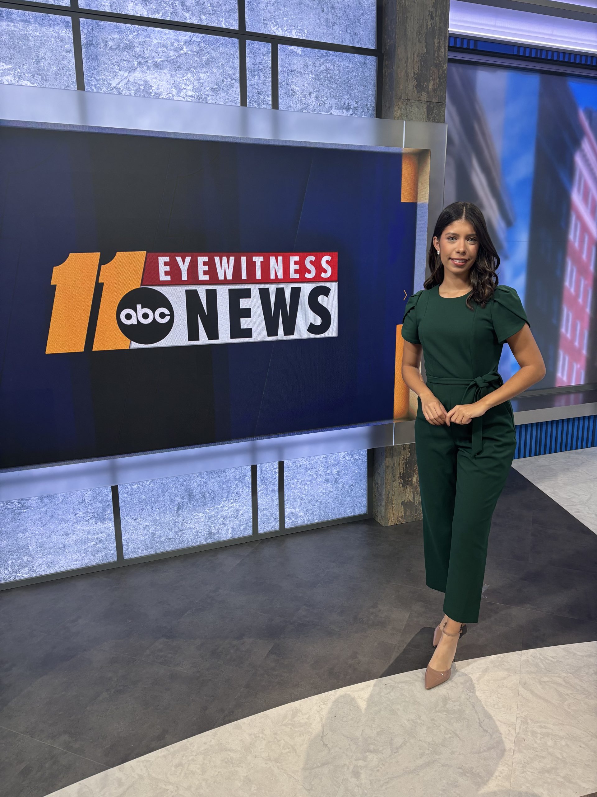 Penelope, a multimedia journalist for ABC News affiliate WTVD, stands inside an ABC Eyewitness News studio in North Carolina after building her journalism career through internships, mentorship and opportunities connected to NAHJ.