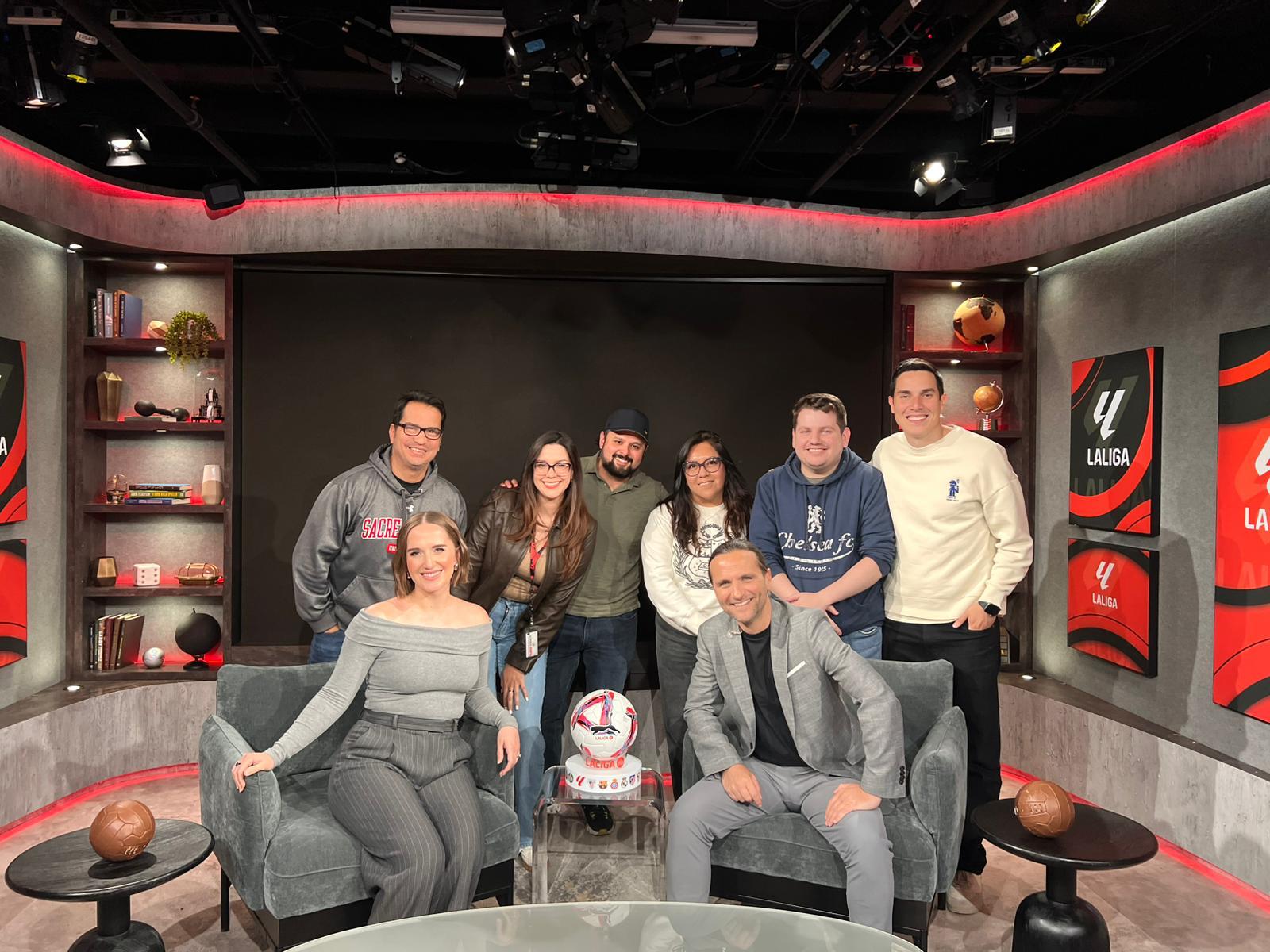 ESPN sports media professionals gather in a studio set, reflecting the collaborative environment, career development opportunities and diverse talent supported through organizations like NAHJ.
