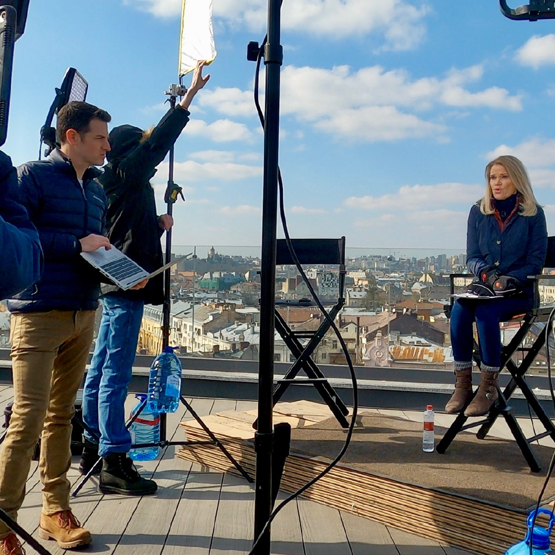 ABC News journalist Sam participates in an outdoor news interview setup on a rooftop, supporting broadcast coverage as part of his career in television journalism and news production.