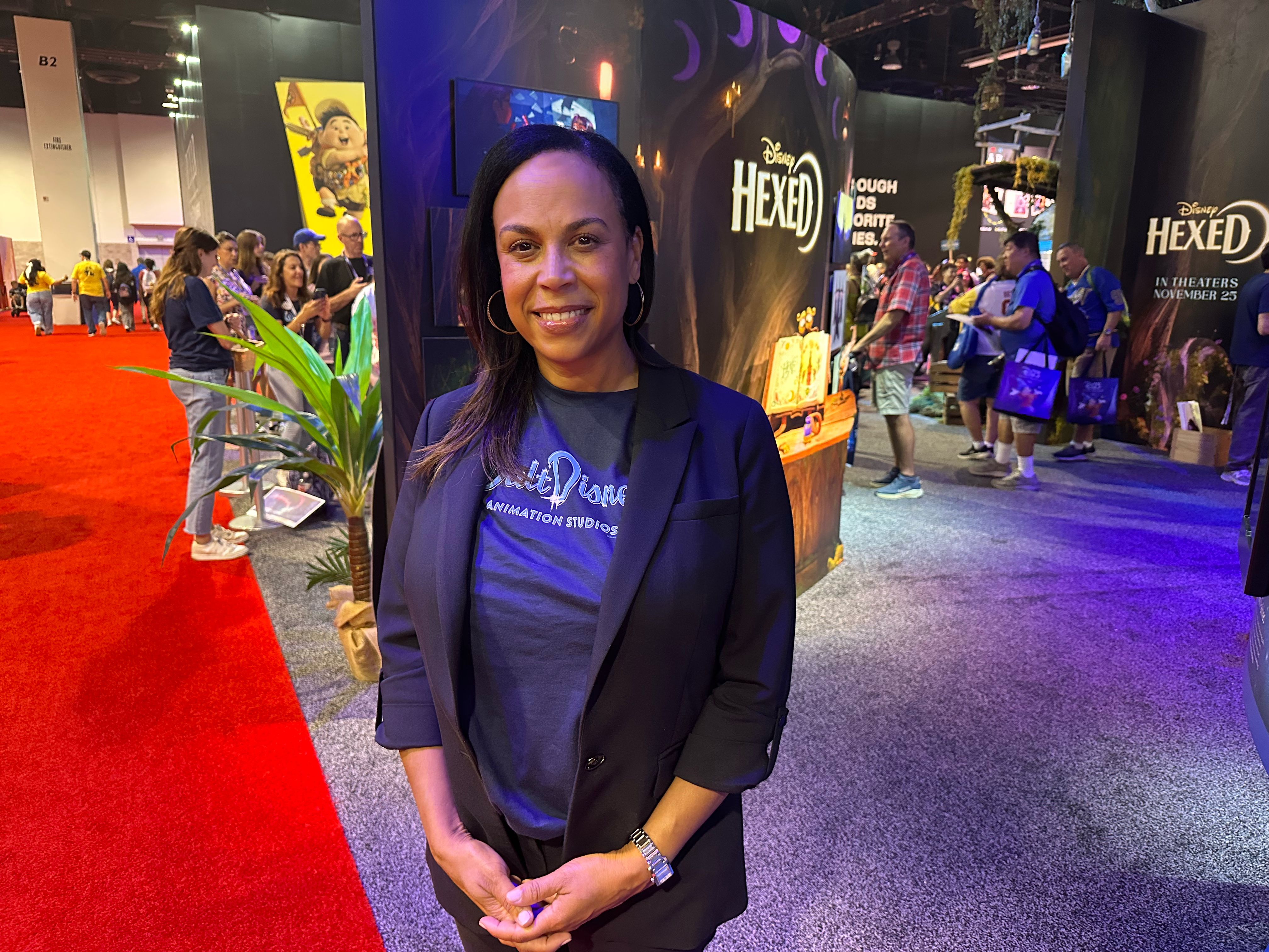 A Walt Disney Animation Studios leader stands inside the Disney Animation exhibit at D23: The Ultimate Disney Fan Event, showcasing the creativity, storytelling, and animation careers behind upcoming films and beloved Disney characters.