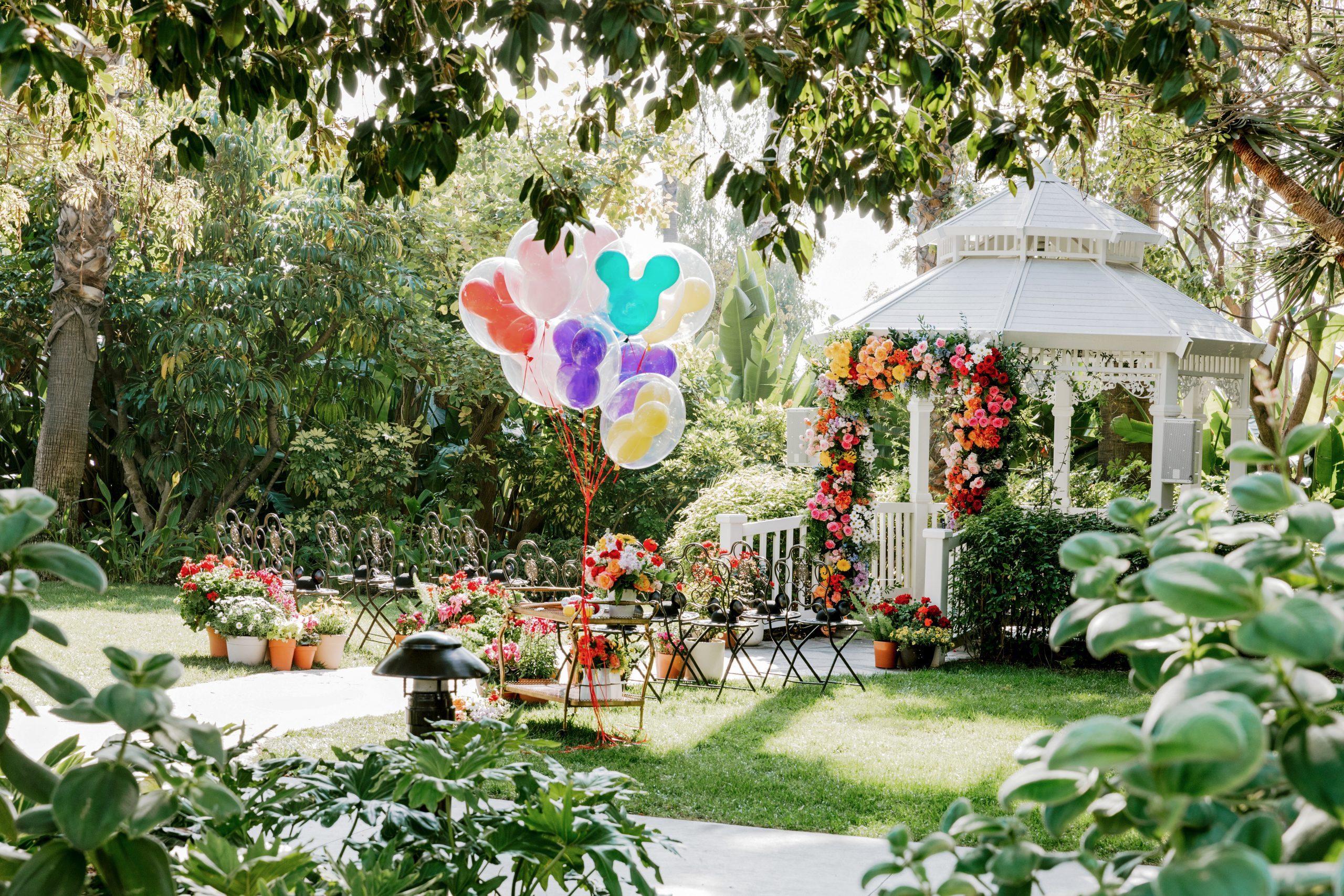 Outdoor Disney wedding ceremony setting featuring colorful floral arrangements and Disney-inspired details.