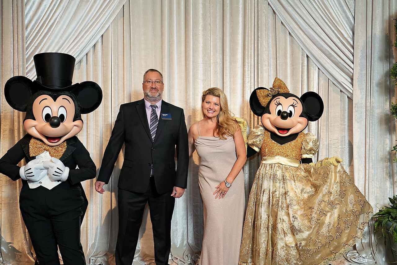 Disney cast members Bennett and Andrea with Mickey Mouse and Minnie Mouse at the 2025 Walt Disney Legacy Award Celebration