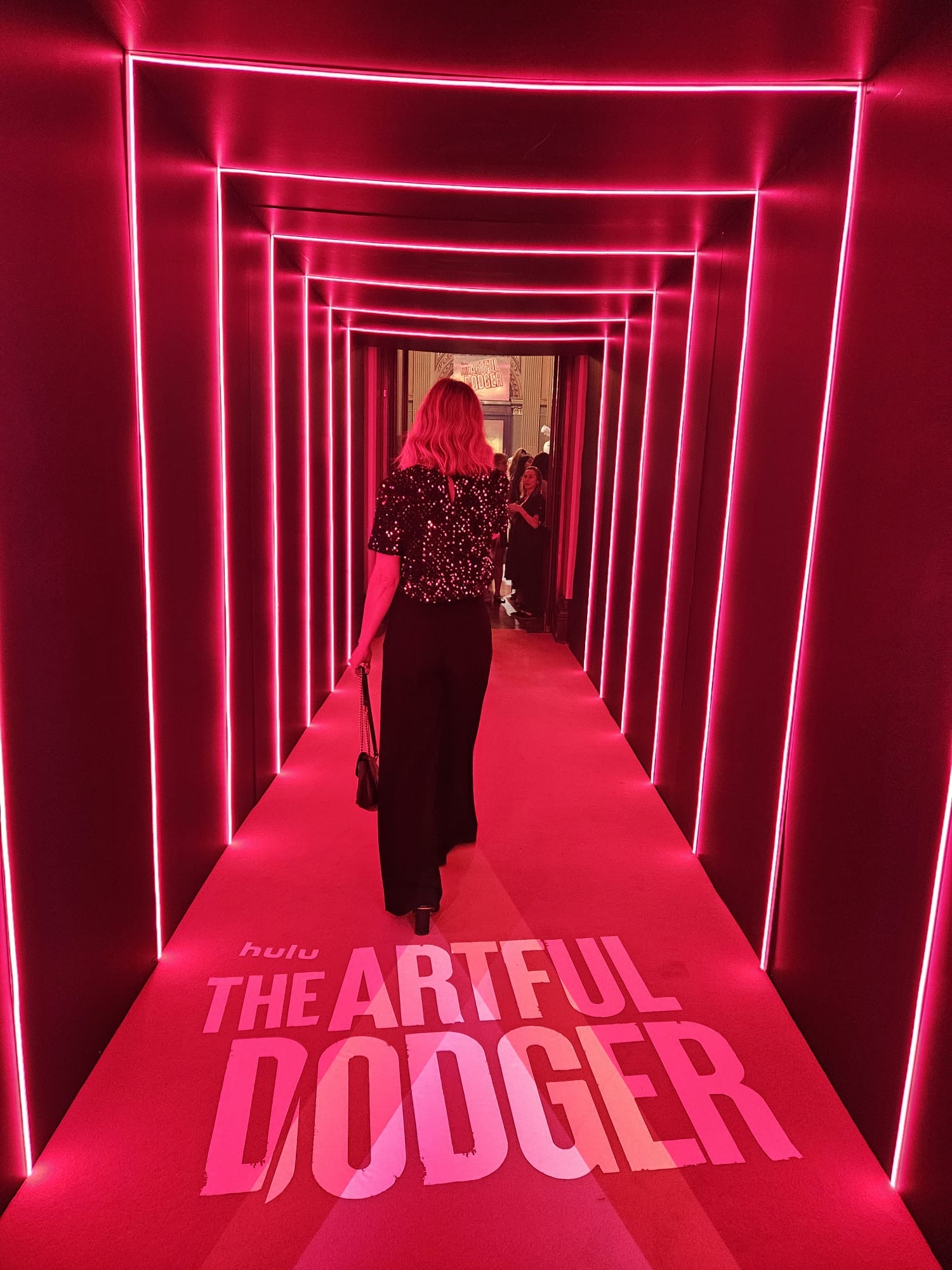 The Artful Dodger event featuring a red illuminated walkway for the Disney+ Australian original series.