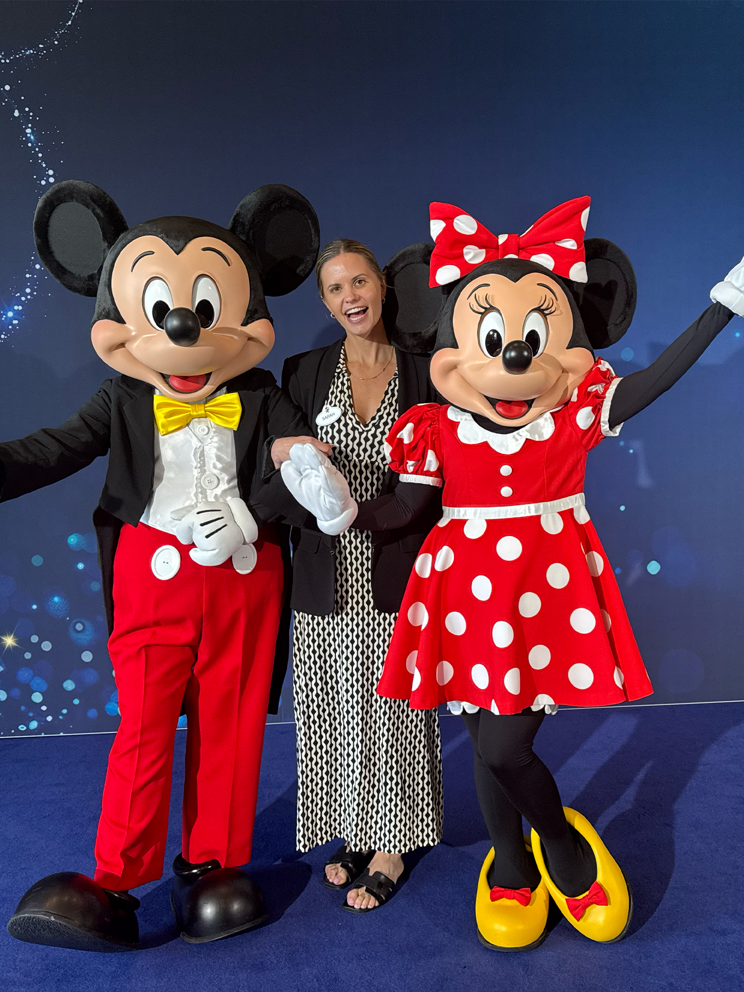 Disney Australia and New Zealand local content employee pictured with Mickey Mouse and Minnie Mouse.