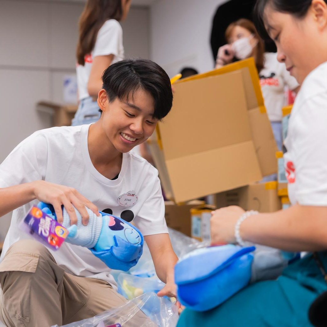 Image of employee packing toys in a box