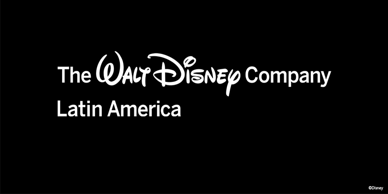 O logotipo da Walt Disney Company em branco contra um fundo preto