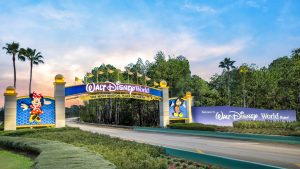 Walt Disney World entrance sign at dusk